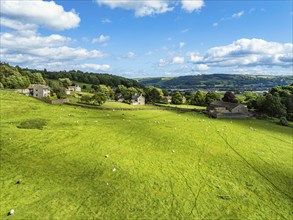 Farms and Fields over Cononley and River Aire from a drone, Keighley, North Yorkshire, England,