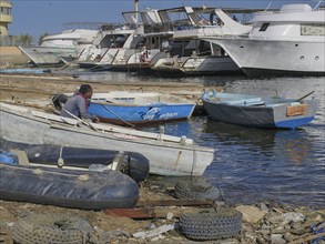 Labourer, boat building and repairs, yacht shipyard, Hurghada, Egypt, Africa