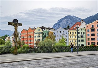 Mariahilf St. Nikolaus, oldest part of Innsbruck with the Inn bridge and the crucifix by Rudi Wach,