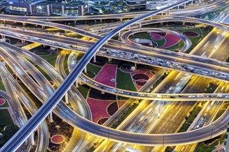 Intersection of Sheikh Zayed Road traffic on the road near the Burj Khalifa with Metro in Dubai,