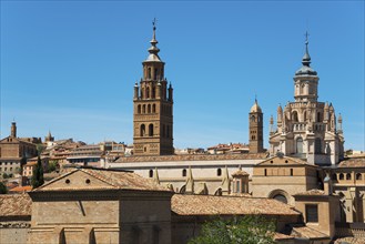 Historic church with several towers and brick facade in front of a clear blue sky, Cathedral,