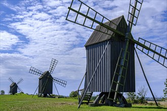 Three traditional historic windmills (Resmo väderkvarnar) in the village of Resmo on Öland, Kalmar