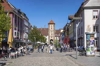 Pedestrian zone, shopping street with the Obertor, historic town gate of Villingen,