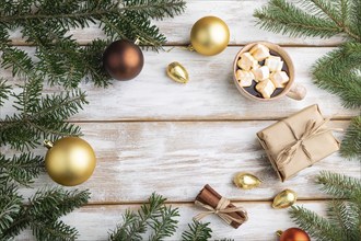 Christmas or New Year frame composition. Decorations, box, golden balls, cinnamon, fir and spruce