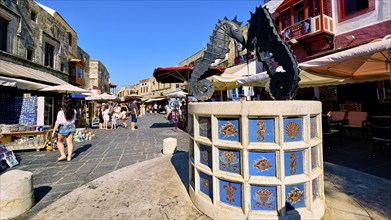 Martyrs Square, Lively market square with a fountain showing seahorse statues, surrounded by shops