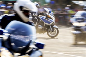 Berlin police officers from the motorbike squadron during a column ride at the Berlin police open