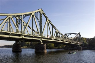 Anglers in a boat at the Glienicke Bridge in Potsdam. The Glienicke Bridge today forms the city