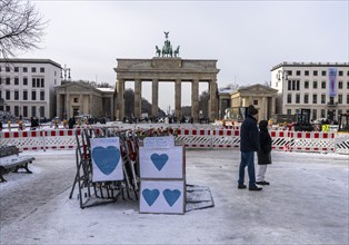 Demonstration, posters and barriers at the Brandenburg Gate, Berlin, Germany, Europe