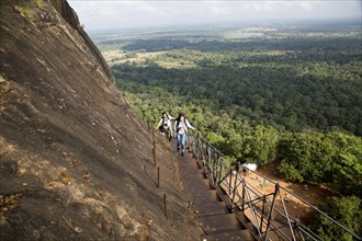 Metal staircase ascending from rock palace fortress, Sigiriya, Central Province, Sri Lanka, Asia