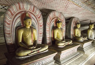 Buddha figures inside Dambulla cave Buddhist temple complex, Sri Lanka, Asia