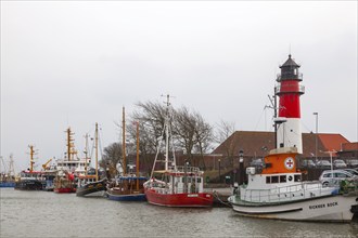 Büsum fishing harbour with lighthouse, Büsum, North Sea, Schlewig-Holstein, Germany, Europe