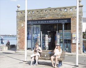 Museum and Heritage centre Swanage, Dorset, England, UK two girls eating chips