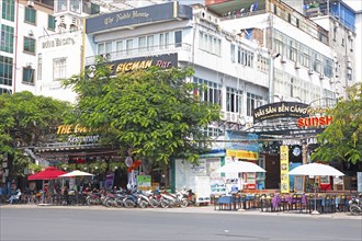 Mopeds and restaurants on the harbour promenade of Cat Ba Town, Cat Ba Island, Halong Bay, Vietnam,