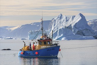 Fiscer boat in front of icebergs, fjord, summer, sunny, Uummannaq, West Greenland, Greenland, North