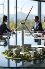 Business professionals engaged with a scale model of a wind turbine adjacent to miniature houses,