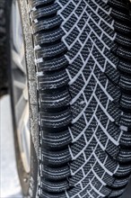 Winter tyres, driving on a road with snow cover, grip on the snow thanks to the special tread and