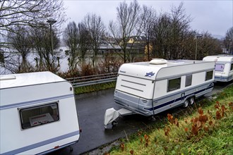 Flood on the Ruhr, here near Hattingen, caravans pulled into the dry at a flooded campsite, flooded