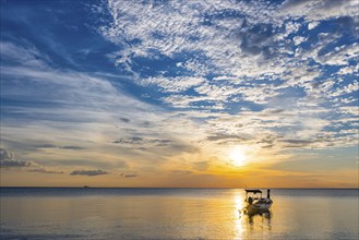 Longtail boat in the sunset, boat, sun, evening mood, cloudy sky, colourful, orange, wooden boat,