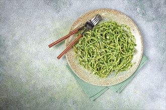 Spaghetti with pesto sauce, homemade, no people