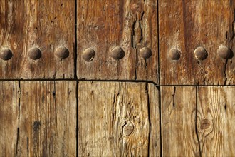 Close-up of an old solid wooden door with metal rivets, Granada, Andalusia, Spain, Europe