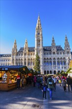 Christmas tree, stalls and visitors at the Christmas market at the town hall, behind the town hall,