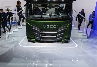 Visitors to the IAA Transportation trade fair take a look at an IVECO driver's cab, Hanover,