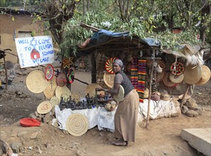 Amhara region, in the Falasha village of Wolleka near Gondar, Gonder, woman selling home-made