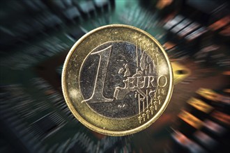 Symbolic image of the digital euro: one-euro coin against a virtual background