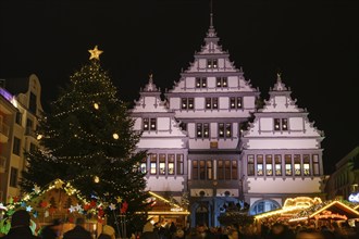 Christmas market in front of illuminated town hall, night shot, Paderborn, Westphalia, North