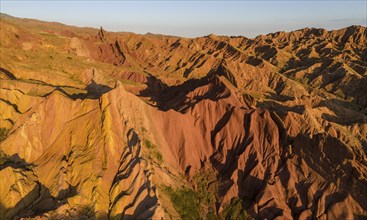 Aerial view, eroded mountain landscape, sandstone cliffs, canyon with red and orange rock