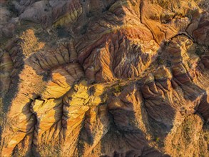 Aerial view, eroded mountain landscape, sandstone cliffs, canyon with red and orange rock