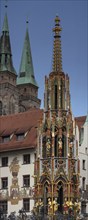 The 19 metre high Schöne Brunnen fountain on the Hauptmarkt is a copy made of shell limestone in