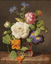 Classical still life of a colourful bouquet of flowers with white and red roses, primroses and