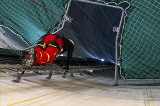 Height rescuers from the Oberhausen professional fire brigade practise abseiling from a wind