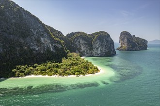 Steep karst cliffs and beach on the islands of Koh Lao Liang, Thailand, Asia