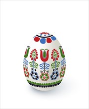 Floral motif painted Easter egg over white background, vector illustration