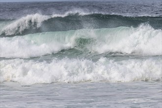 Turquoise blue wave in the Iroise Sea. Camaret, Crozon, Brittany, France, Europe