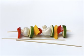 Colourful vegetable skewers and barbecue skewers