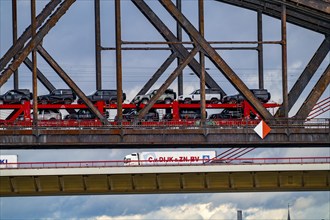 The Beeckerwerther Rhine bridge of the A42 motorway, truck traffic, in front of it the Haus-Knipp