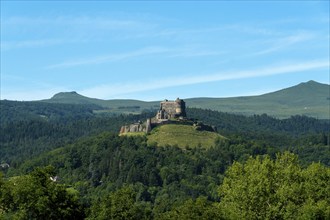 View of the medieval castle of Murol in the Auvergne Volcanoes Regional Natural Park, Puy de Dome,