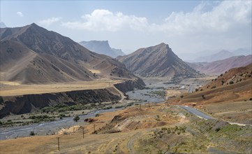 Pamir Highway, mountain road through eroded mountain landscape, Kyrgyzstan, Asia