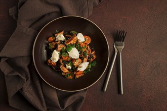 Warm Salad with crispy eggplant and tomatoes, cottage cheese, spices, herbs, sesame seeds,