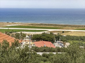 View from military cemetery hill height 107 near Maleme on runway landing strip from today small