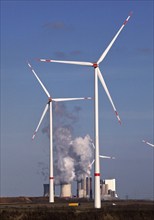 Wind turbines at the Garzweiler open-cast lignite mine with the Neurath power station in the