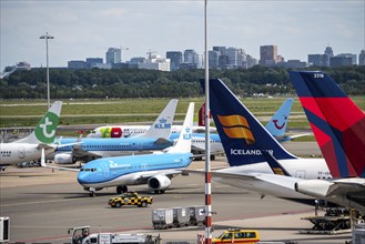 Amsterdam Schiphol Airport, aircraft at the terminal, Gates D, check-in, apron, skyline of