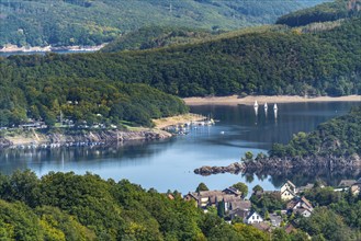 View from above the village of Woffelsbach, to the east, of Lake Rursee, Eifel National Park, North