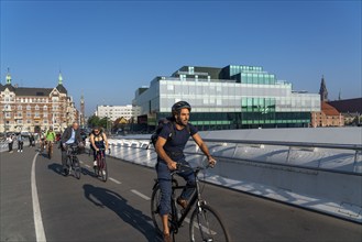 Cyclists on the Lille Langebro cycle and pedestrian bridge over the harbour, Copenhagen is