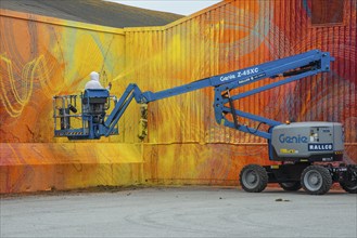 American street artist Douglas Hoekzema, also known as HOXXOH paints a wall in Ystad, Skåne County,