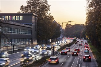 City centre street with heavy traffic in the evening. Dynamic light trails with long exposure time.