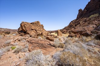 Barren landscape with red boulders in a valley, desert landscape, Twyfelfontein, Kunene, Namibia,